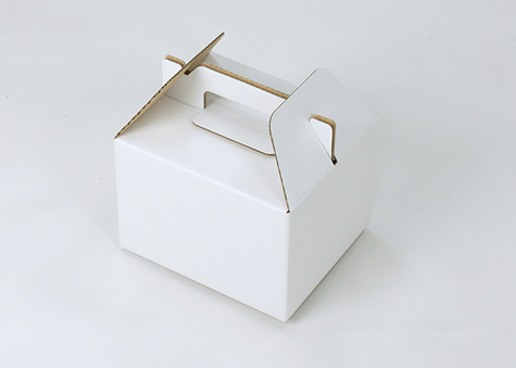 ケーキ箱のように持ち手が付いた、テープ不要のB式段ボール箱
